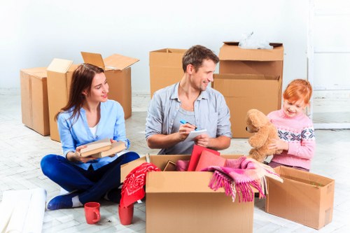 Professional movers handling furniture in a Bermondsey flat or apartment