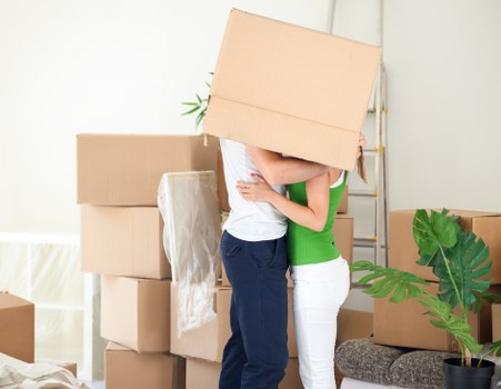Local moving team transporting boxes and household items in Bermondsey